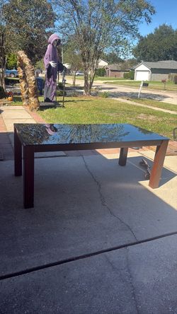 wooden table with glass table top