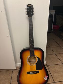 Squier by Fender Acoustic Guitar Sunburst and piano keyboard