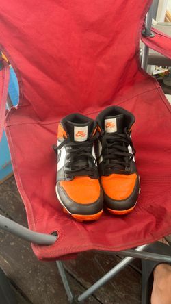 Nike football cleats there are orange white and black and it is a size 6