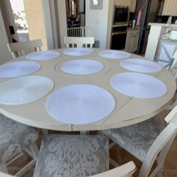 PRICE REDUCED TO SELL ASAP  Counter height table with lazy Susan and 8 chairs