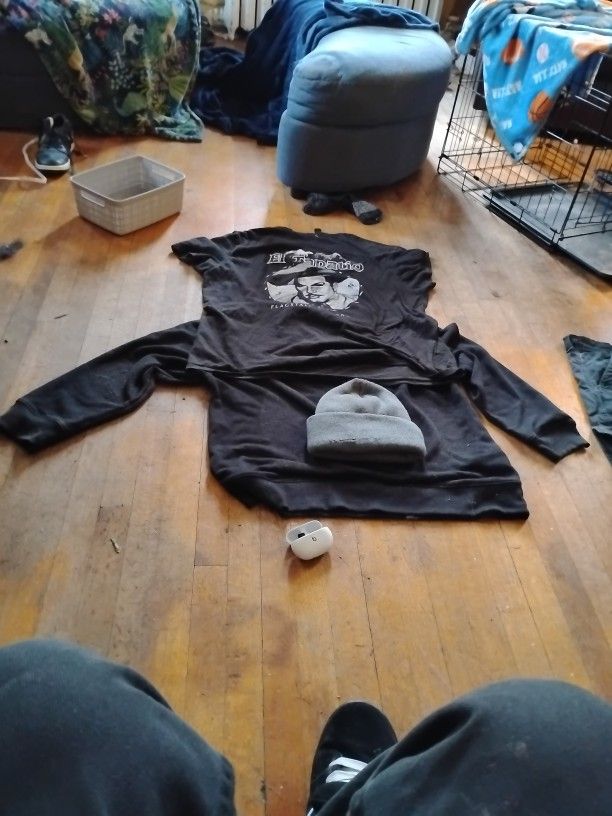 el Tapatio Shirt Black And White, XL Black Khakis, Large Long Sleeve Heavy Shirt Black, And Gray Beanie, And Beats Earbuds With 1 Earbud.