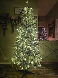 Absolutely gorgeous 7 ft prelit flocked Christmas tree