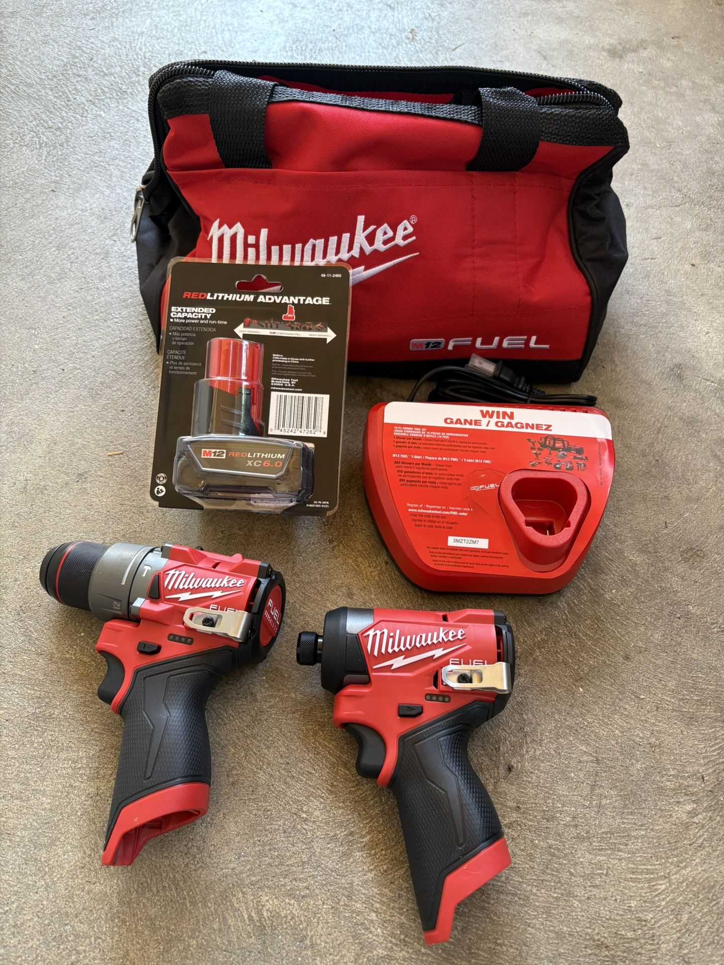 Milwaukee M-12 Fuel. Hammer Drill Driver /Impact Driver. Charger. 6.0 Battery. Tool Kit
