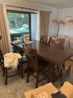 Dining room high top table with 6 chairs.