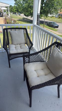2 outdoor chairs with cushions