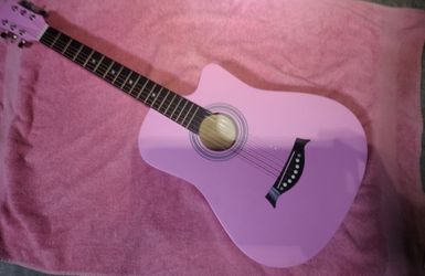pink guitar and accessories