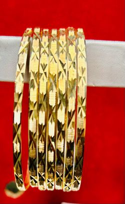 14 k gold ladies and men brazaletes.