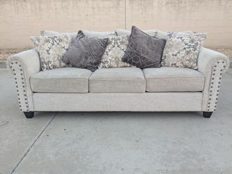 Light Gray Fabric Sofa with Nailhead Trim