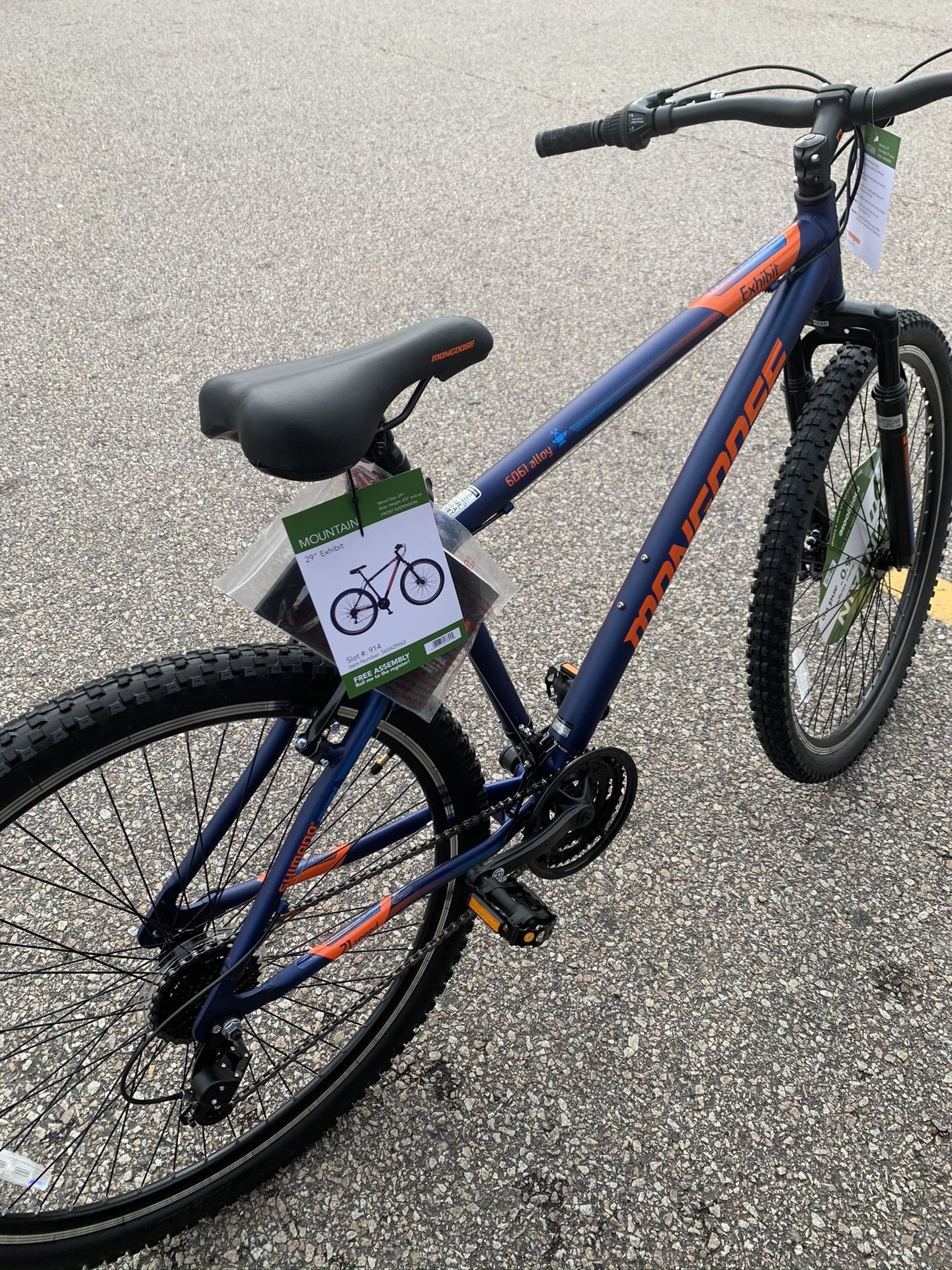 Mongoose Exhibit Mountain Bike, 29-inch wheels, 21 speeds, blue