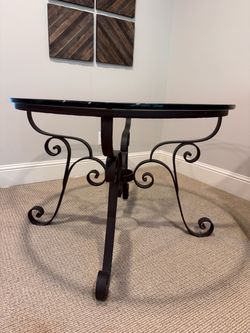 Glass top wrought iron dining table
