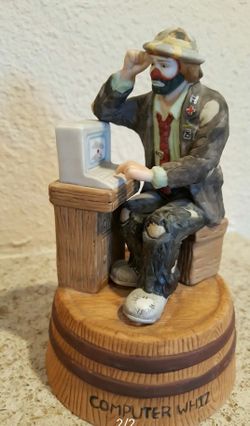 Vintage Emmett Kelly Jr Figurine "Computer Whiz" with stand. This vintage collectible is from flambr