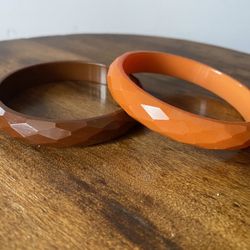 Bakelite faceted bangles from the 1940’s. Tangerine and mahogany bracelets