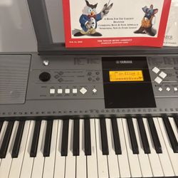 Yamaha electronic keyboard with stand