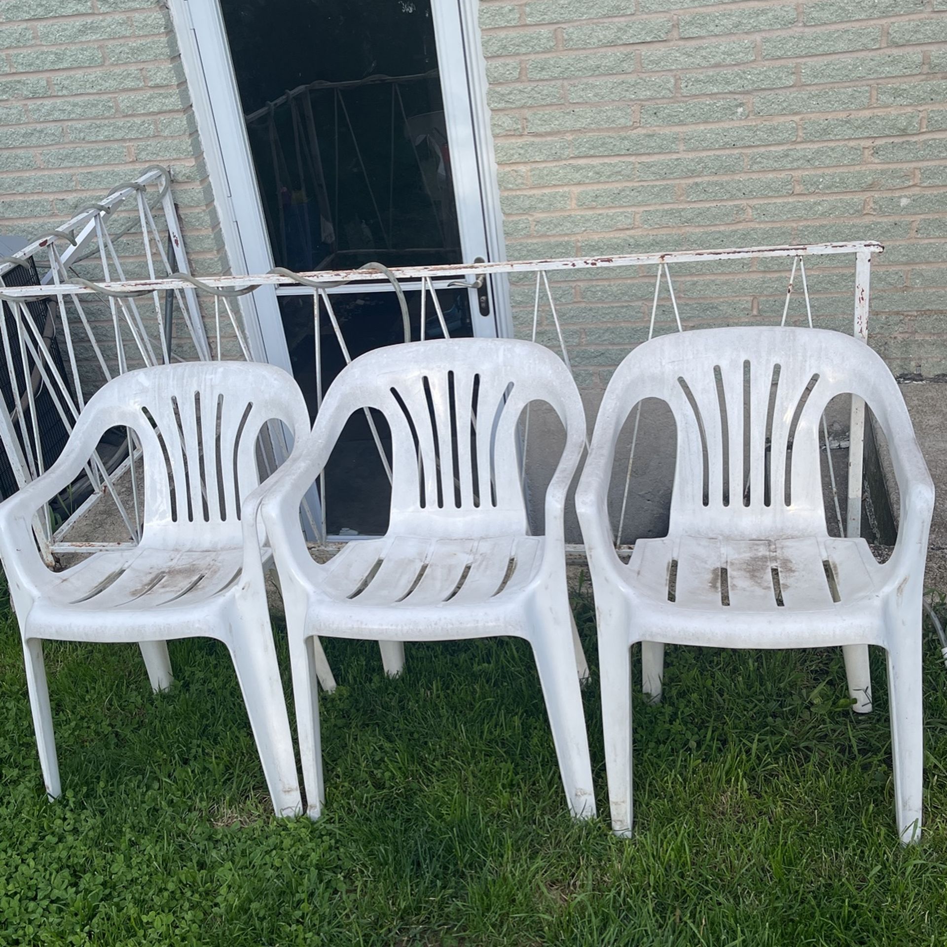 Plastic 3 Chair Outside 