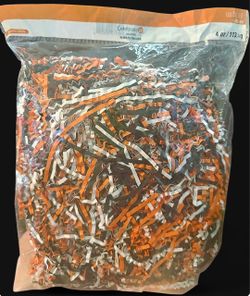 Orange and black shredded paper for Halloween decor