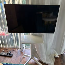 Tv On Roller Stand 32”