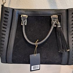 black leather bag new, never used tags on it
