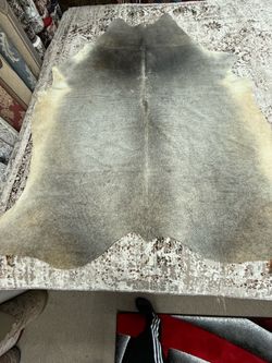 Cowhide area rug on sale