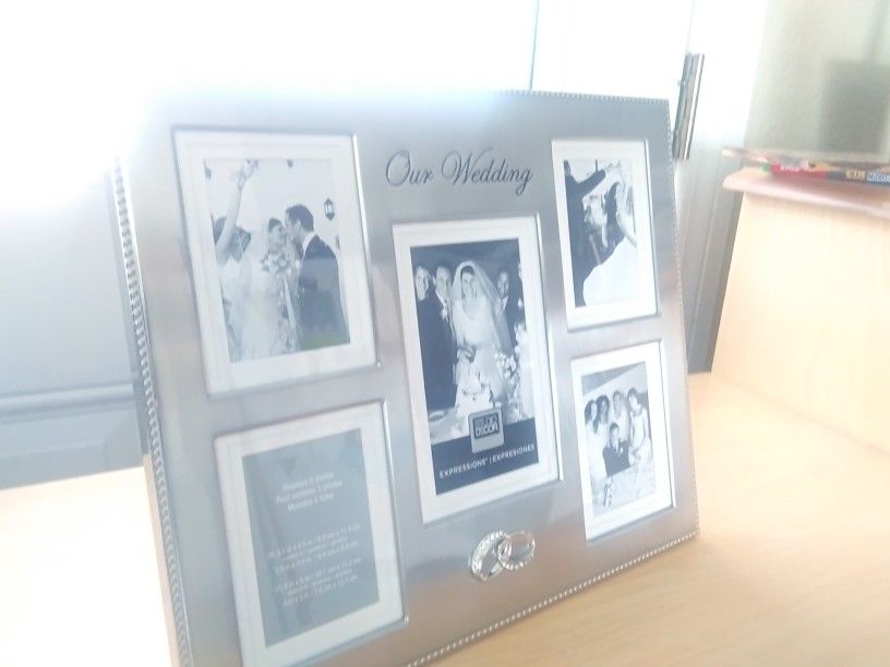 NEW Multi Picture Wedding Photo Frame - $10

/obo