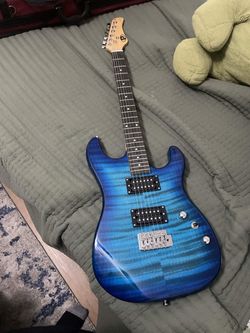 Blue electric guitar,  Amp, and extras