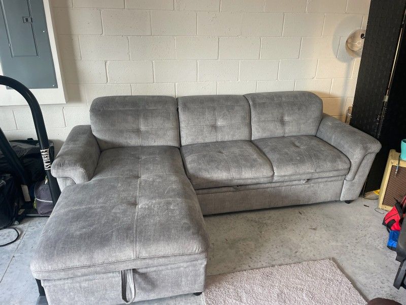 Barely Used Sectional with Storage and pullout bed