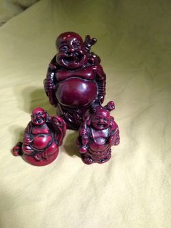 Three miniature Buddha statues