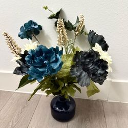Artificial Floral Arrangement in Blue Glass Vase