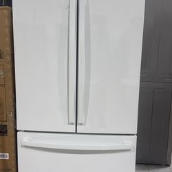 White GE French door, refrigerator with interior water dispenser, and icemaker