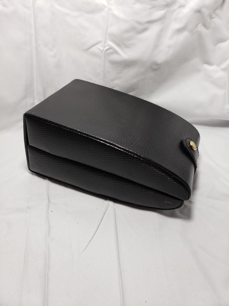 Black jewelry travel case . Good condition.  Holds several pieces to take on vacation . 