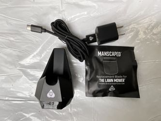 manscaped the lawn mower 4.0 replacement charger kit with wireless charging dock, usb-c cable, ac adapter, and extra blade.