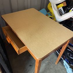Wooden table with draw