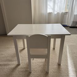 A small table and chair for a child