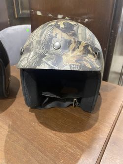 Raider A-611 open-face helmet in a camouflage pattern, likely a Realtree size Large