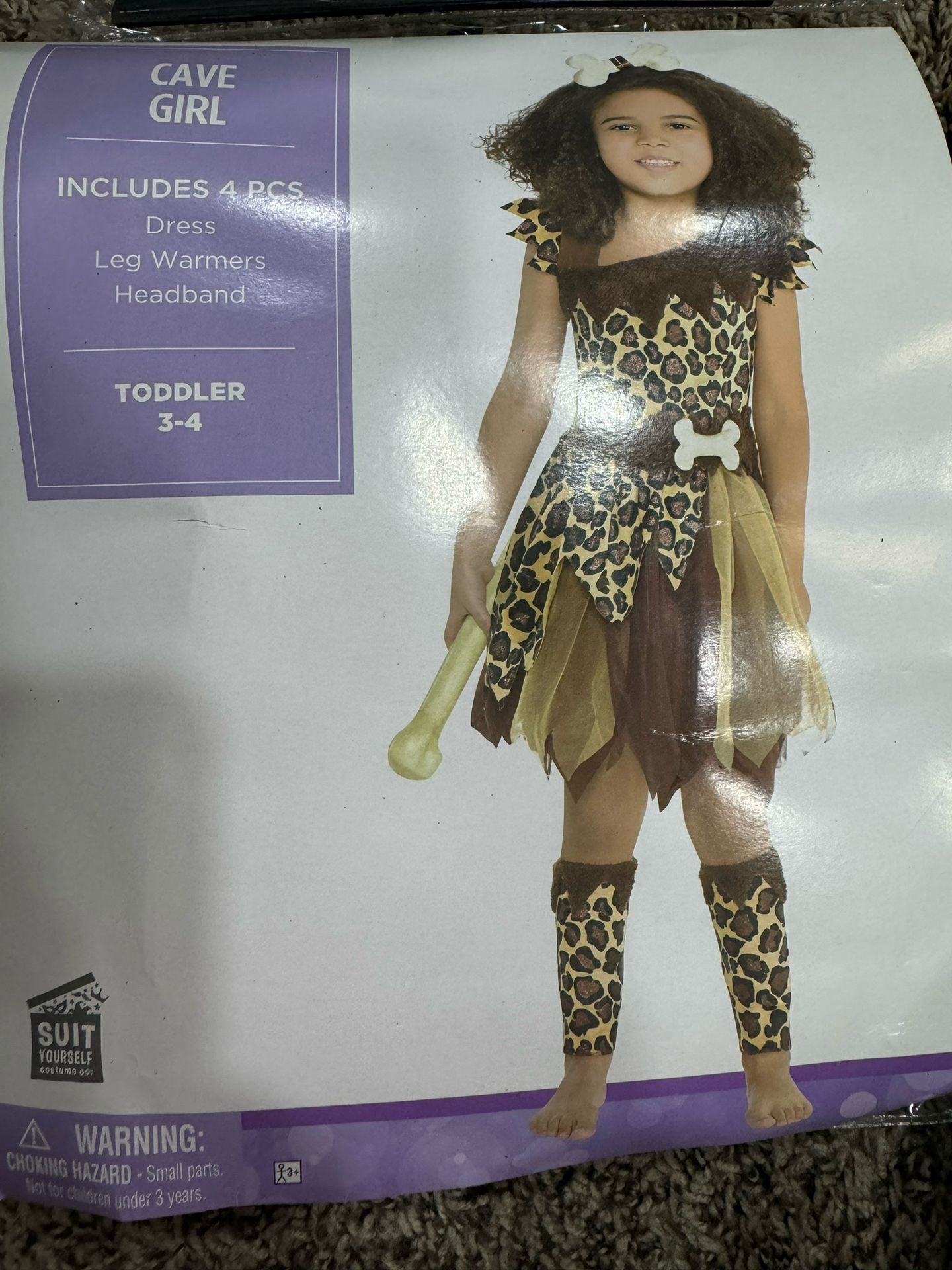 New In packaging, cave girl costume
