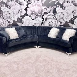 Curved black velvet sectional couch