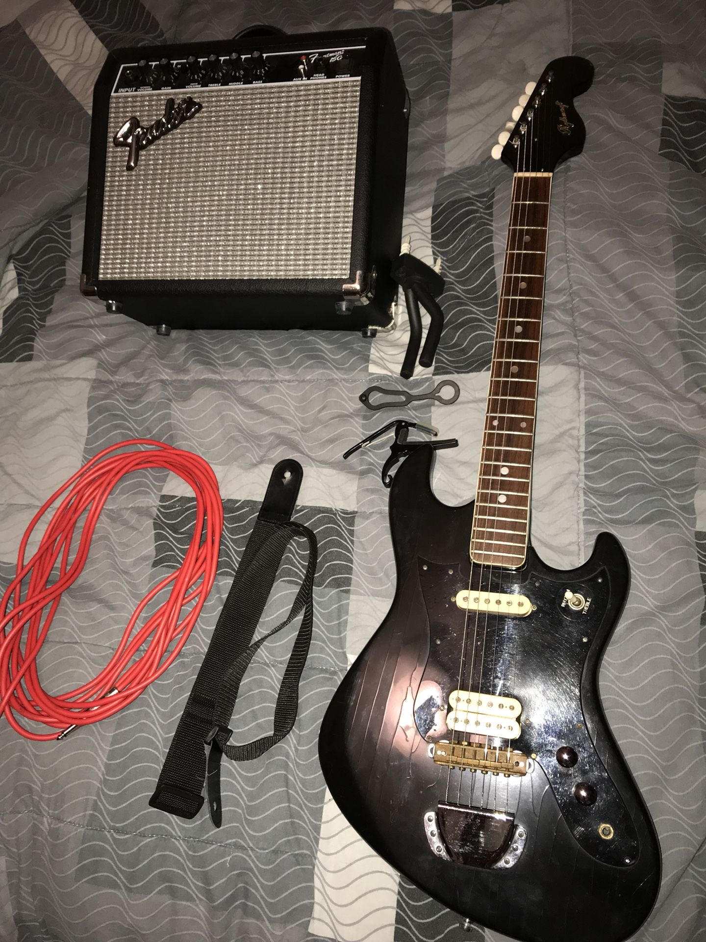 Vintage japan electric guitar with cord strap fender amp an wallmount an capo