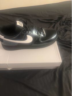 A pair of Air Force One, one time unlimited, edition, black and white