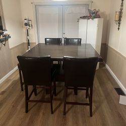 Table And 4 Chairs And One Stool