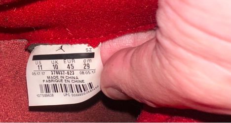 Red Air Jordan sneakers, size US 11