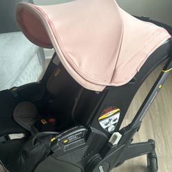 Pink Doona stroller 