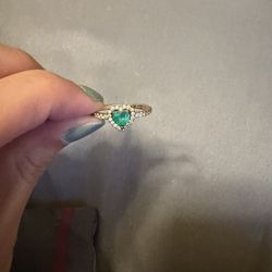 gold band emerald color heart shaped ring
