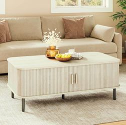 47.2 in Modern fluted coffee table with hidden storage and sliding tambour doors.