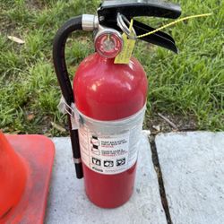 Orange Traffic Cone And Fire Extinguisher