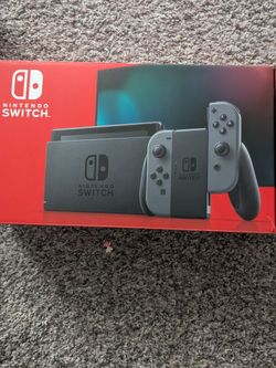 Nintendo Switch Console Neon Red/Blue and a grey/black one