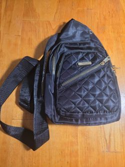 Black purse/shoulder bag. Plenty of pockets to store things.