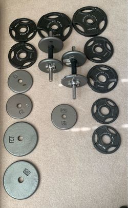 Adjustable dumbbells sets with 100 pounds plates good condition no rust