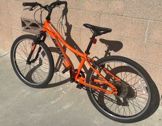 Giant XtC Jr 24 Lite youth mountain bike in vibrant orange