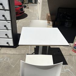 Table and two chairs 