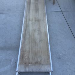Metaltech 7ft x 19in aluminum scaffold platform with a plywood deck