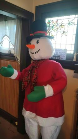 Life size snowman 6 foot and 2 inches tall.